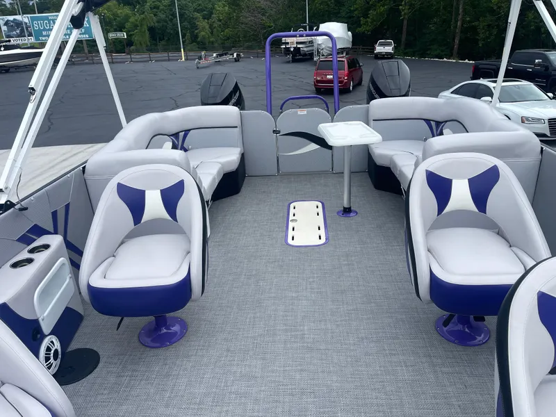 Slide: The Image of 2023 PlayCraft 3000 Infinity Extreme pontoon boat interior with modern seating and table. - 27