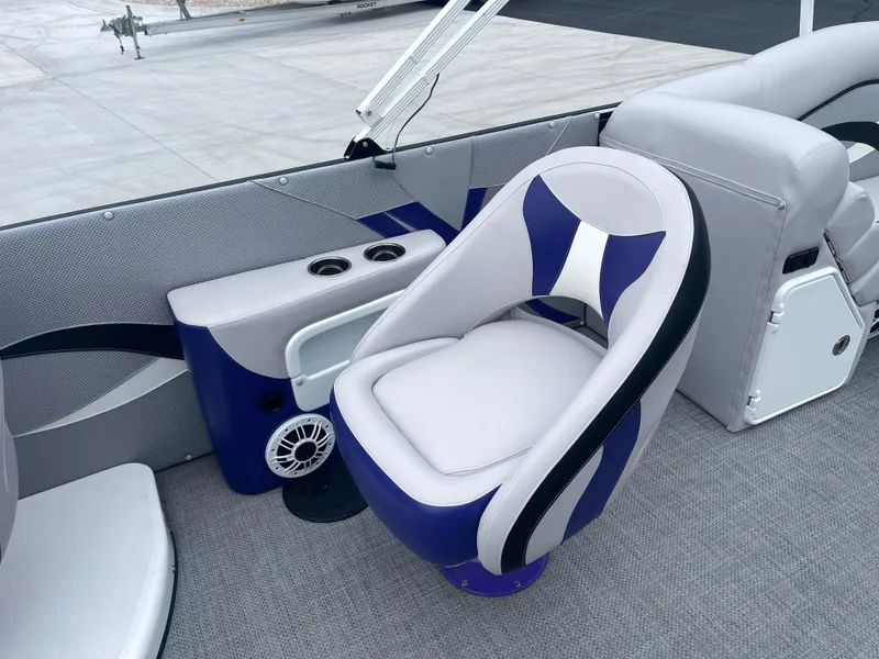 Slide: The Image of Luxury seating on 2023 PlayCraft 3000 Infinity Extreme boat, featuring cup holders and speaker. - 28