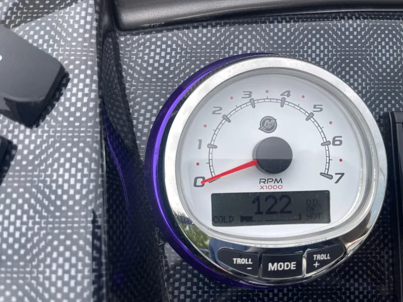 Slide: The Image of Close-up of 2023 PlayCraft 3000 Infinity Extreme RPM gauge displaying 122 RPM. - 33