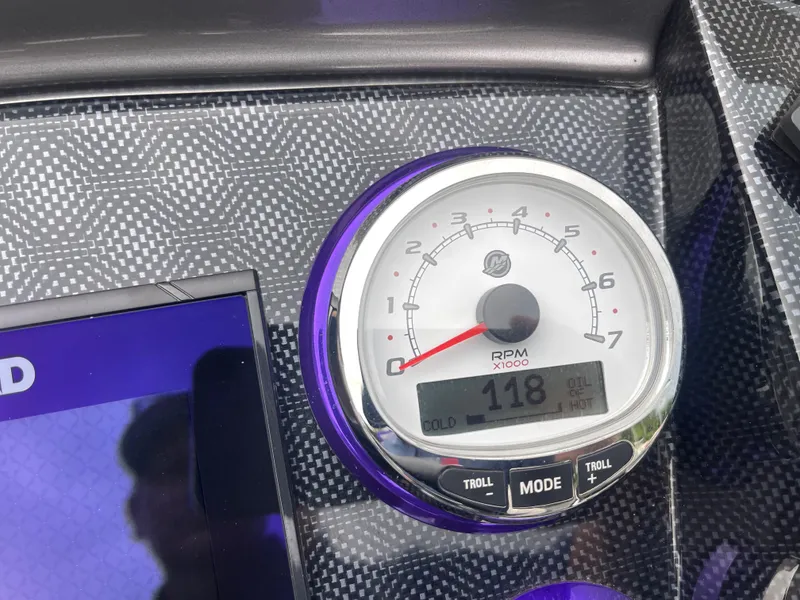 Slide: The Image of Dashboard of 2023 PlayCraft 3000 Infinity Extreme showing RPM gauge and digital display. - 34