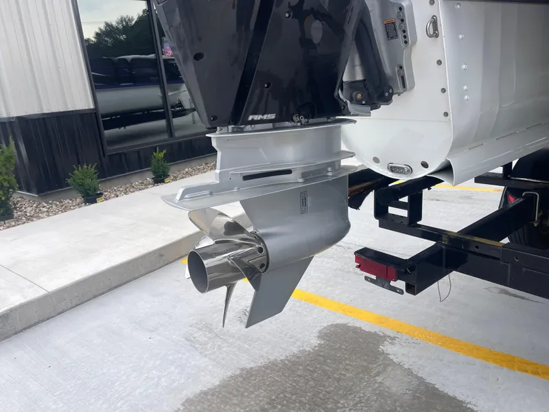 Slide: The Image of 2023 PlayCraft 3000 Infinity Extreme boat motor and propeller on a trailer. - 37