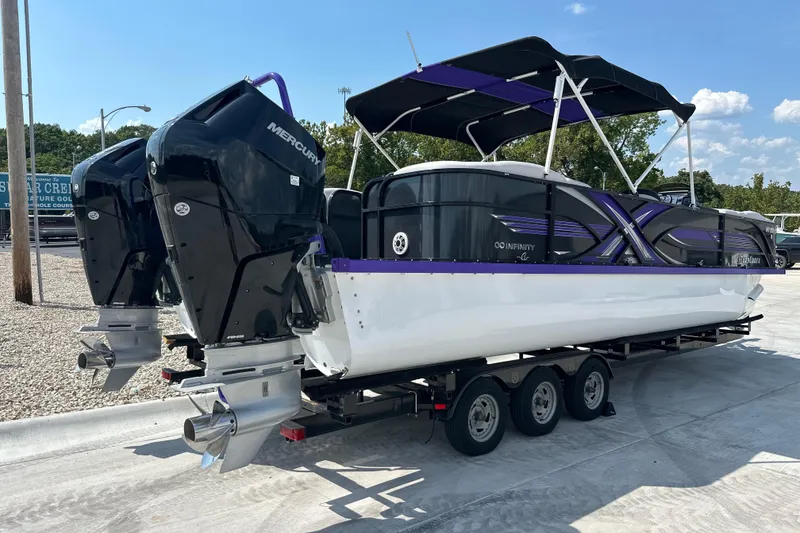 Slide: The Image of 2023 PlayCraft 2800 Extreme boat with dual Mercury engines on a trailer. - 5