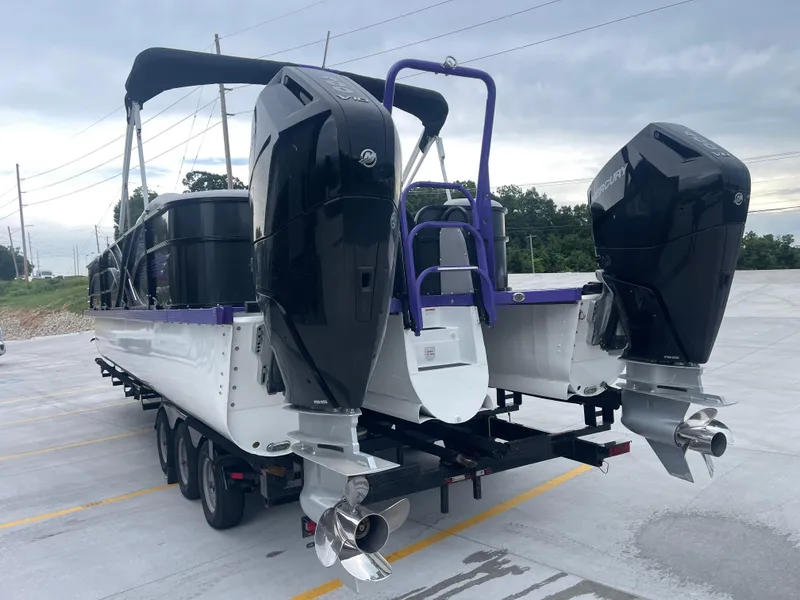 Slide: The Image of 2023 PlayCraft 3000 Infinity Extreme boat on trailer with dual Mercury outboard engines. - 8