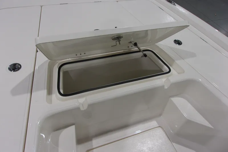 Slide: The Image of Open storage compartment on 2026 Skeeter 241 boat, showcasing interior space. - 10