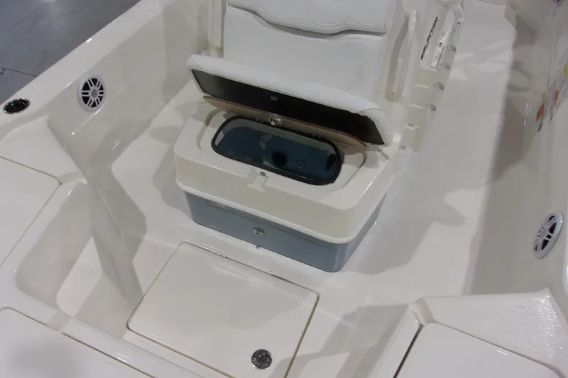 Slide: The Image of 2026 Skeeter 241 boat interior with white seating and storage compartments. - 11