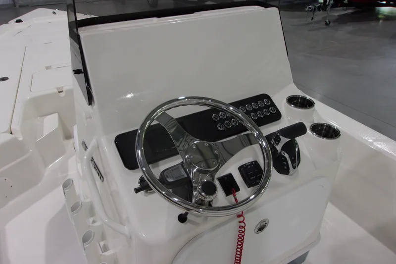 Slide: The Image of Steering console of 2026 Skeeter 241 boat with chrome wheel and control panel. - 15