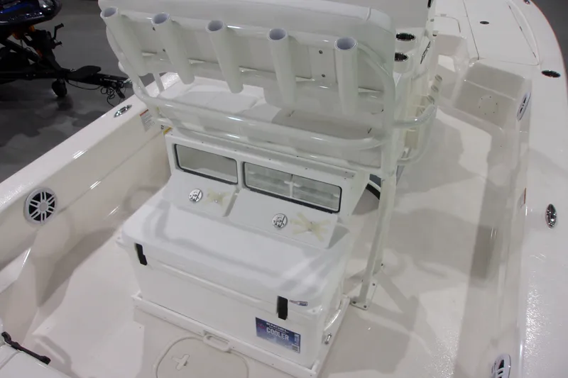 Slide: The Image of 2026 Skeeter 241 boat interior with rod holders and storage compartments. - 17