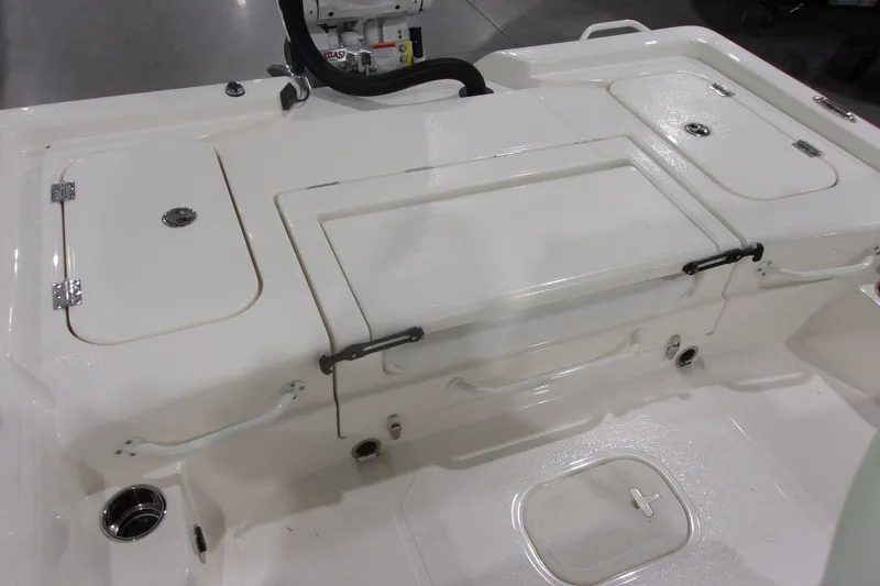 Slide: The Image of 2026 Skeeter 241 boat deck with storage compartments and clean white finish. - 18