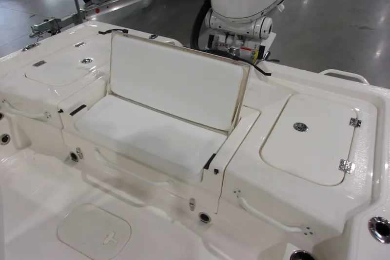 Slide: The Image of 2026 Skeeter 241 boat interior with white seating and storage compartments. - 19