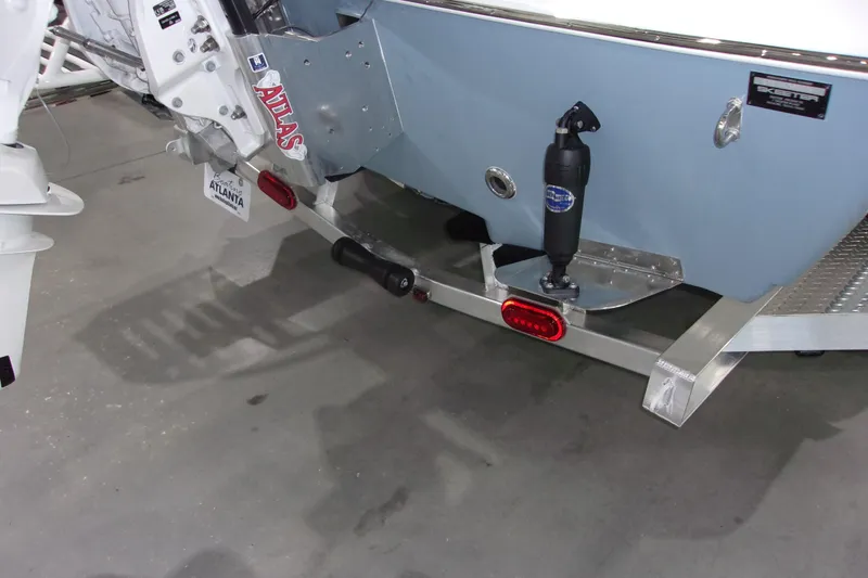 Slide: The Image of Rear view of 2026 Skeeter 241 boat with trailer and motor components. - 5