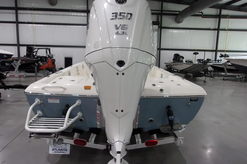 Slide: The Image of 2026 Skeeter 241 boat with powerful 350 V6 engine in showroom. - 6
