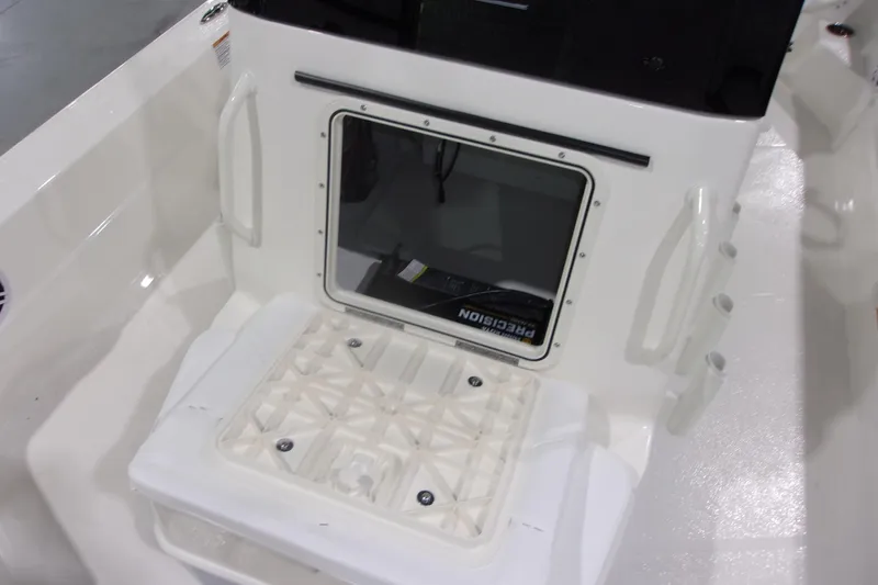 Slide: The Image of 2026 Skeeter 241 boat interior with storage compartment and seating area. - 9