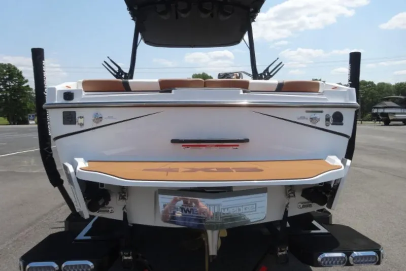 Slide: The Image of 2024 Axis T220 boat rear view with swim platform and wakeboard tower. - 1