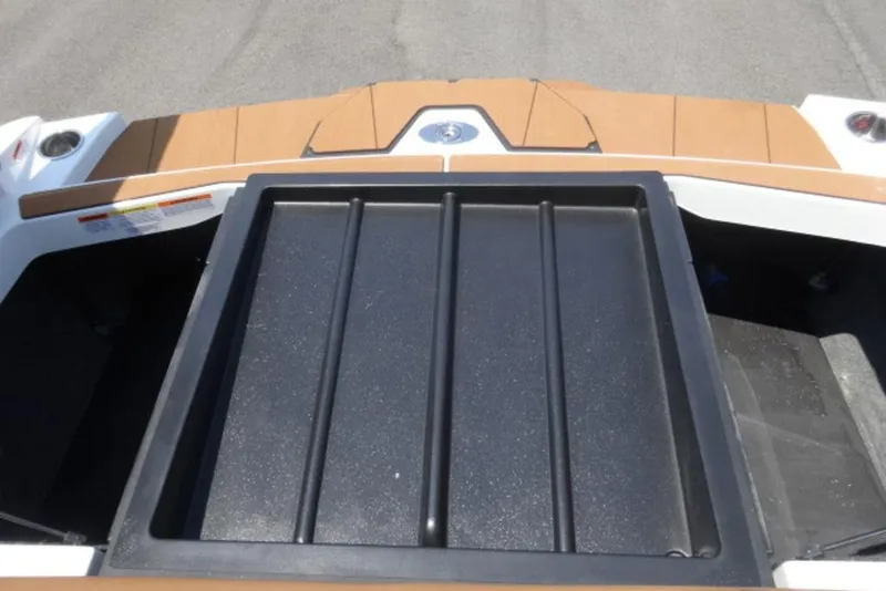 Slide: The Image of 2024 Axis T220 boat rear deck with storage compartment, featuring sleek design and durable materials. - 11