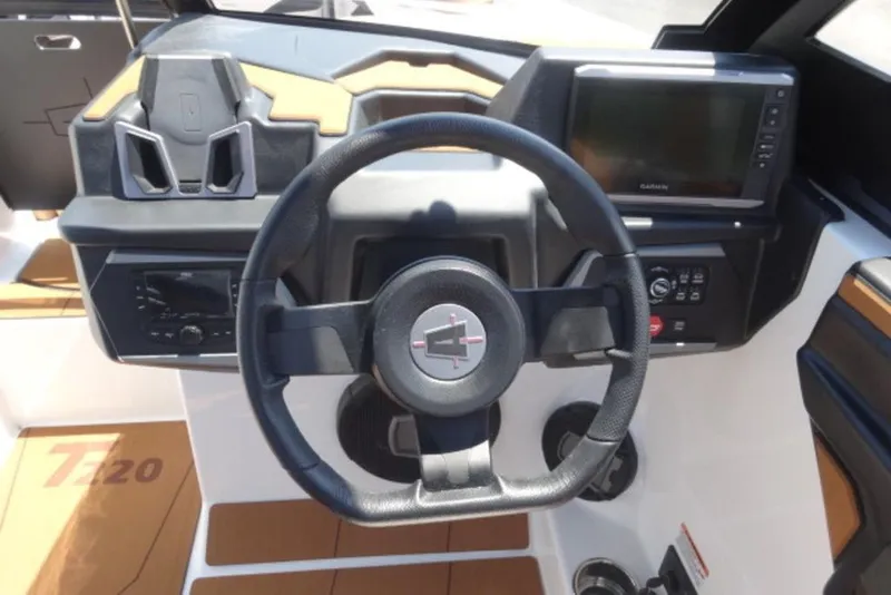 Slide: The Image of 2024 Axis T220 boat dashboard with steering wheel and navigation display. - 3
