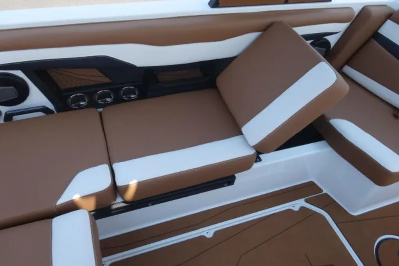 Slide: The Image of 2024 Axis T220 boat interior with brown and white cushioned seating. - 4