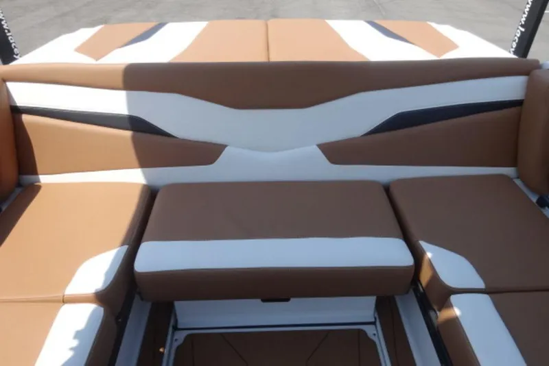 Slide: The Image of 2024 Axis T220 boat interior with brown and white seating. - 6