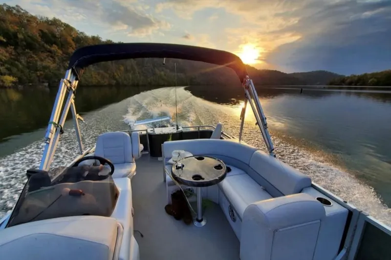 Slide: The Image of 2016 Avalon Catalina LSZ Fish boat cruising on a lake at sunset. - 5