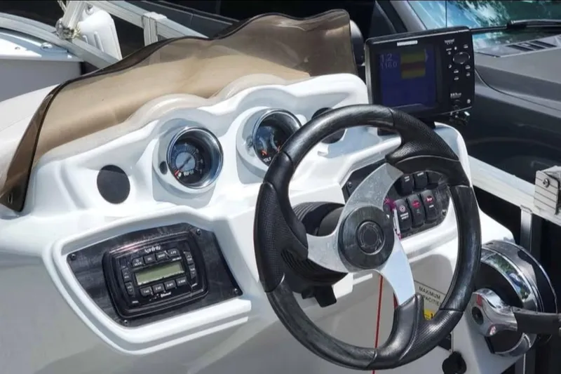 Slide: The Image of 2016 Avalon Catalina LSZ Fish boat dashboard with steering wheel and gauges. - 6