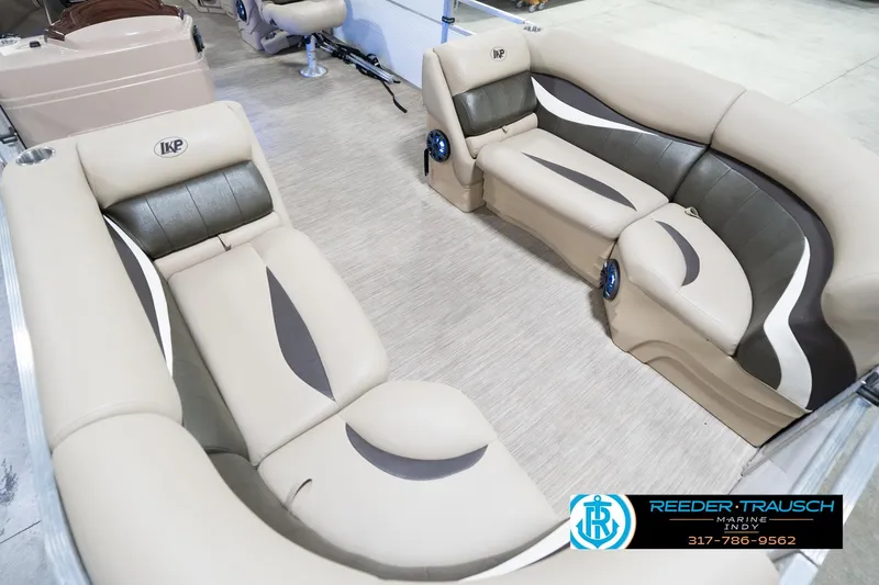 Slide: The Image of Luxurious seating on a 2020 Leisurecraft 2435 LX pontoon boat, featuring stylish beige and gray upholstery. - 12