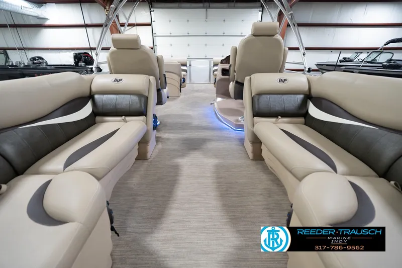 Slide: The Image of Interior of 2020 Leisurecraft 2435 LX pontoon boat with beige seating and modern design. - 18