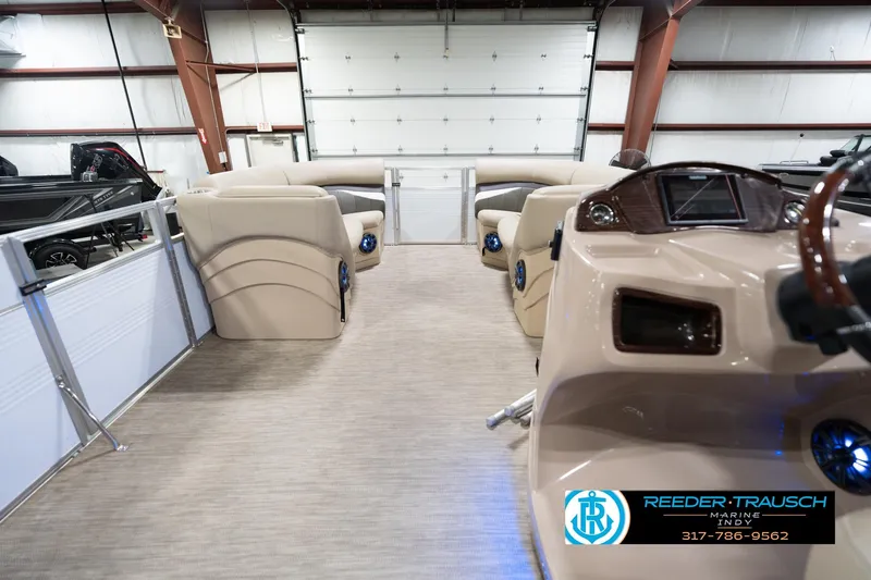 Slide: The Image of Interior of a 2020 Leisurecraft 2435 LX pontoon boat in a showroom. - 19