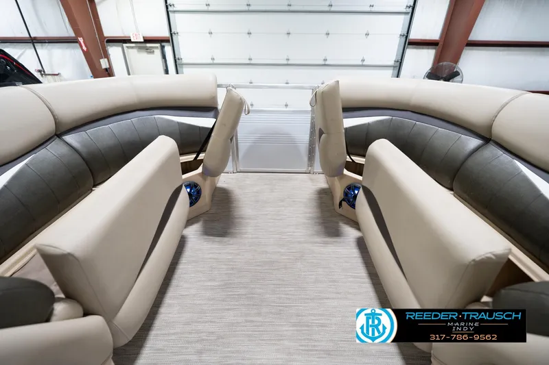 Slide: The Image of Interior of 2020 Leisurecraft 2435 LX boat with beige and gray seating. - 21