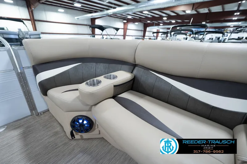 Slide: The Image of Luxurious 2020 Leisurecraft 2435 LX boat interior with plush seating and cup holders. - 22