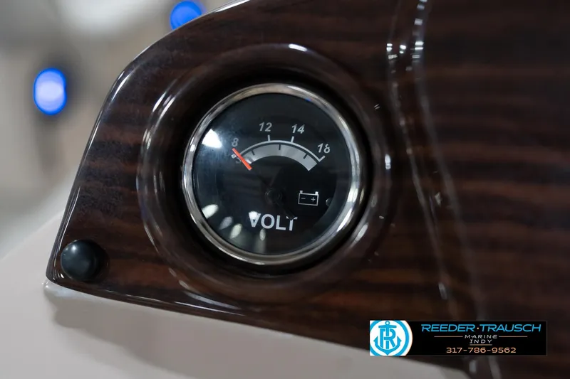 Slide: The Image of Voltmeter on 2020 Leisurecraft 2435 LX dashboard, Reeder-Trausch Marine branding visible. - 31