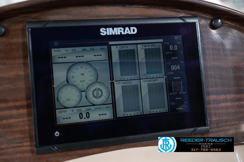 Slide: The Image of Simrad marine display on Leisurecraft 2435 LX, 2020 model, showing navigation and depth data. - 32
