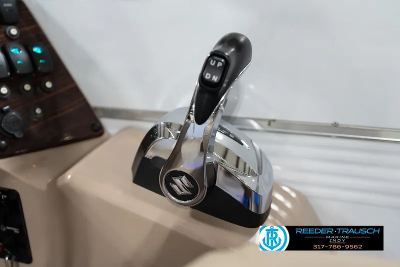 Slide: The Image of Boat throttle control lever on a 2020 Leisurecraft 2435 LX, featuring "UP" and "DN" buttons. - 36