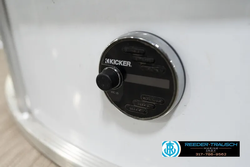 Slide: The Image of Kicker audio control panel on 2020 Leisurecraft 2435 LX boat, Reeder-Trausch Marine logo visible. - 42