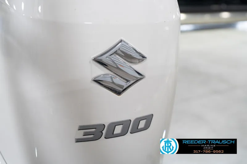 Slide: The Image of Suzuki 300 outboard motor on 2020 Leisurecraft 2435 LX boat, Reeder-Trausch Marine logo visible. - 47