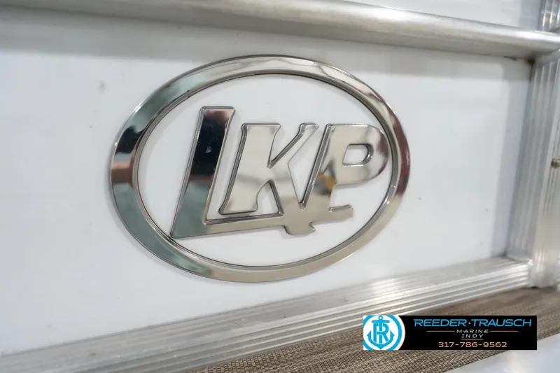 Slide: The Image of Chrome LKP logo on 2020 Leisurecraft 2435 LX boat, Reeder-Trausch Marine contact details visible. - 49
