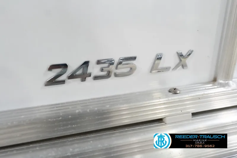 Slide: The Image of Leisurecraft 2435 LX 2020 model emblem on a white surface with Reeder Trausch Marine logo. - 51