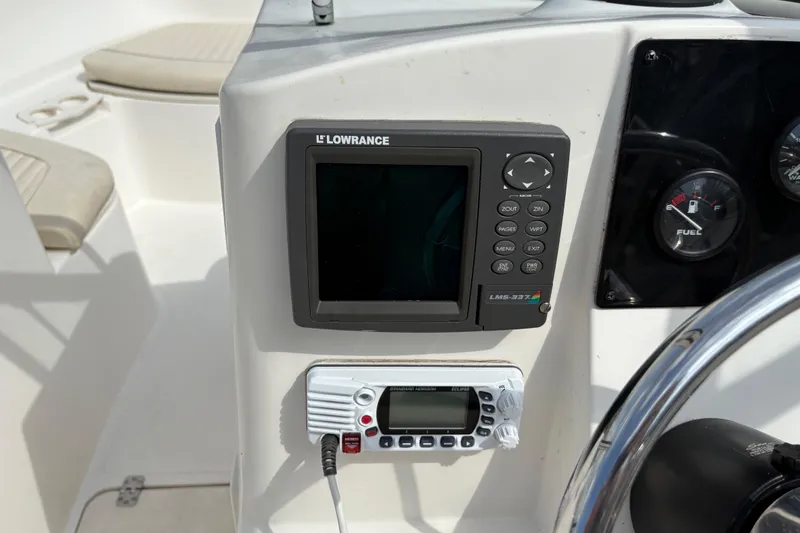Slide: The Image of Console of 2006 Mako 216 Dual Console with Lowrance LMS-337 and marine radio. - 18
