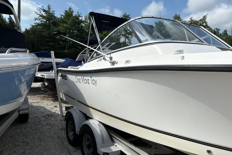 Slide: The Image of 2006 Mako 216 Dual Console boat on trailer, parked outdoors. - 3