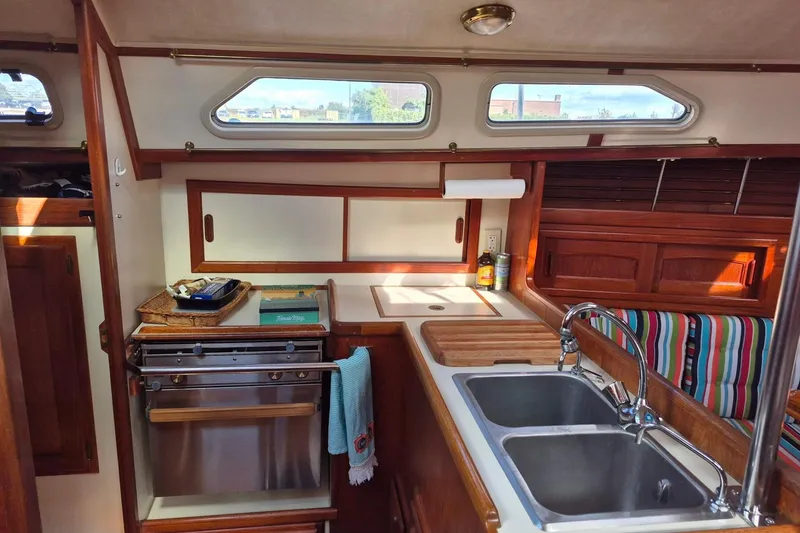 Slide: The Image of Interior of 1992 Pacific Seacraft Ericson 34 sailboat kitchen with sink and stove. - 20