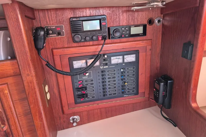 Slide: The Image of Control panel of a 1992 Pacific Seacraft Ericson 34 sailboat with radio and switches. - 27
