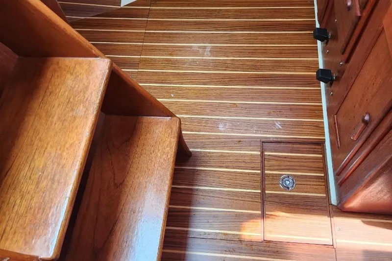 Slide: The Image of Wooden interior of 1992 Pacific Seacraft Ericson 34-2 sailboat, featuring steps and floor. - 29