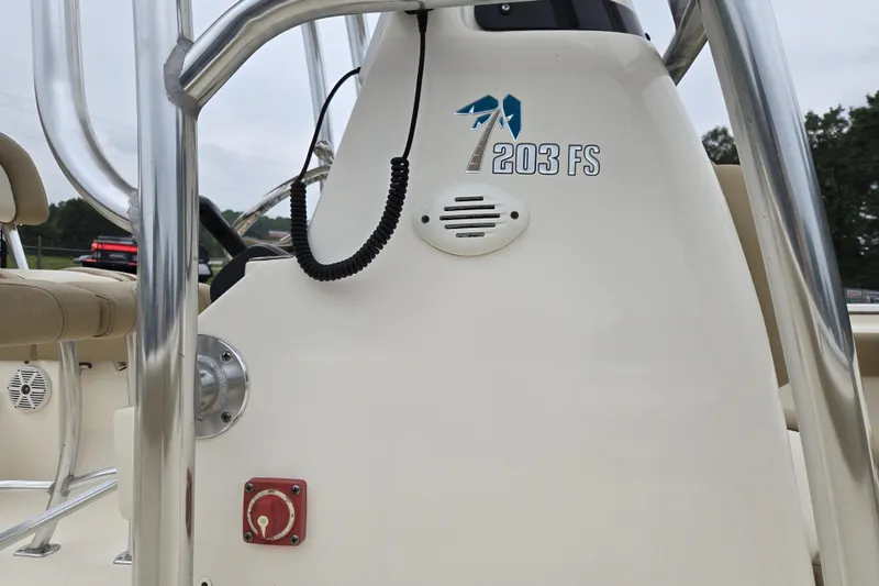 Slide: The Image of 2018 Key West 203 FS boat console with steering wheel and controls. - 10