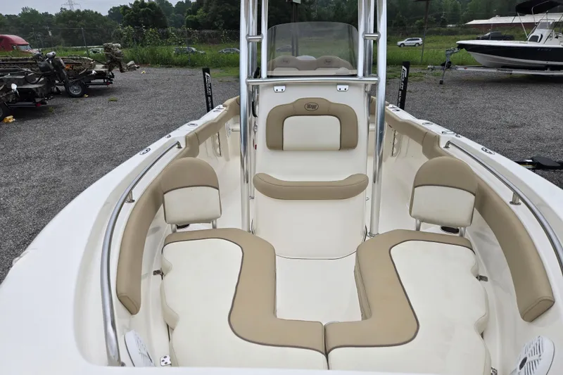 Slide: The Image of 2018 Key West 203 FS boat interior with beige seating and open deck layout. - 11
