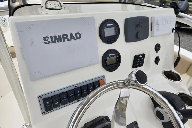 Slide: The Image of Control panel of 2018 Key West 203 FS boat with Simrad electronics and Yamaha gauges. - 13
