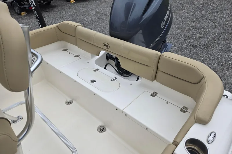 Slide: The Image of 2018 Key West 203 FS boat interior with beige seating and Yamaha engine. - 15