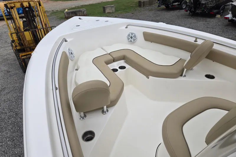Slide: The Image of 2018 Key West 203 FS boat interior with beige seating and cup holders. - 17