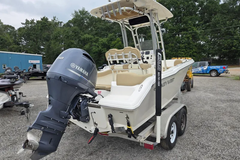 Slide: The Image of 2018 Key West 203 FS boat with Yamaha engine on trailer, parked outdoors. - 4