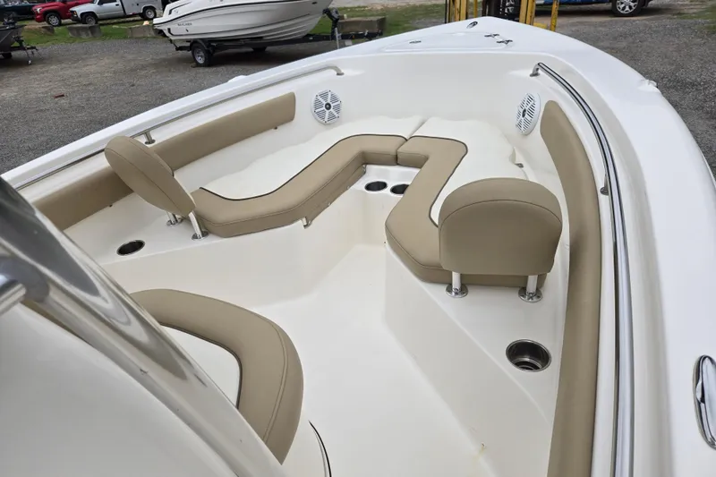 Slide: The Image of 2018 Key West 203 FS boat interior with beige seating and cup holders. - 9