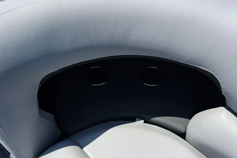 Slide: The Image of 2026 Sun Tracker SportFish 20 DLX boat interior with gray cushioned seating. - 11