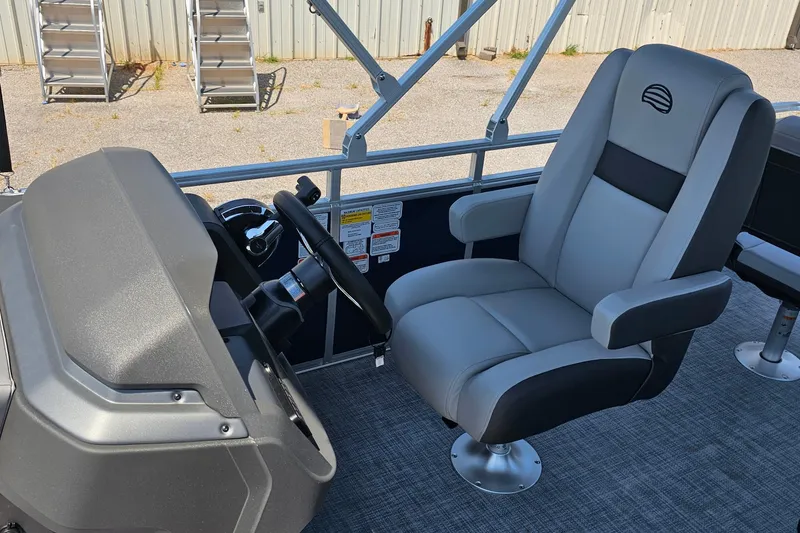 Slide: The Image of Captain's chair and helm of 2026 Sun Tracker SportFish 20 DLX pontoon boat. - 13
