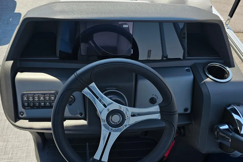 Slide: The Image of Steering console of 2026 Sun Tracker SportFish 20 DLX boat with modern controls. - 14